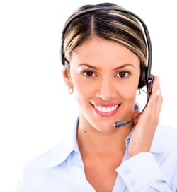 Female telemarketing agent wearing a headset - isolated over white