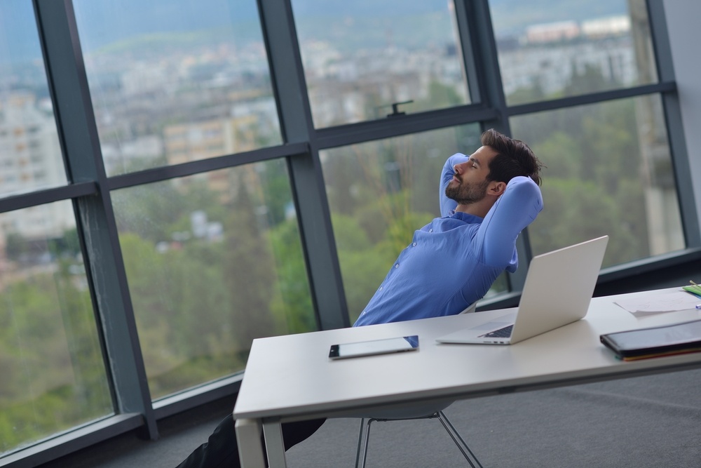 happy young business  man work in modern office on computer-2