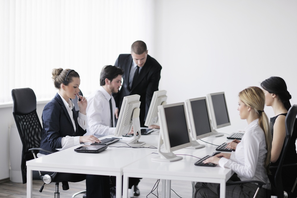 business people group with  headphones giving support in  help desk office to customers, manager giving training and education instructions-2